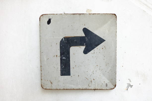 istock Right Arrow Sign on White Cement Wall Background. 677443202