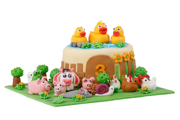 istock birthday cake with farm marzipan animals 677451804