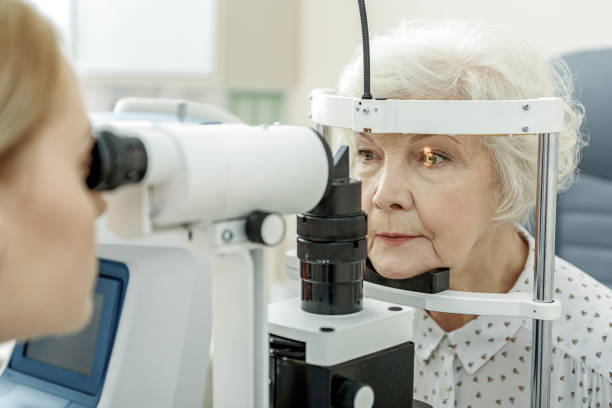 istock Young female ophthalmologist using apparatus 677455342