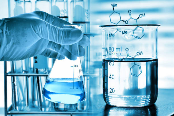 istock Flask in scientist hand with test tubes 677455606
