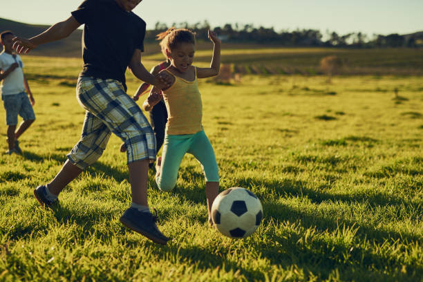 istock Fun with friends and a football 677463400