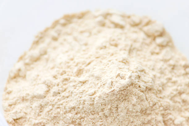 Close up of maca root powder, with white backgrounds