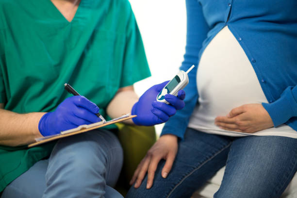 istock Pregnant Woman Having Blood Glucose Checked 677476662