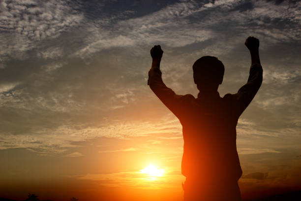 istock silhouette of a happy man and  sunset 677482048