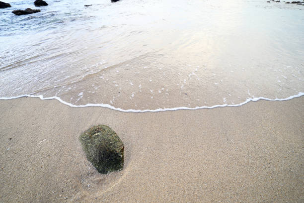 istock Rock and wave on the Ao Sen beach Phuket Thailand 677491876