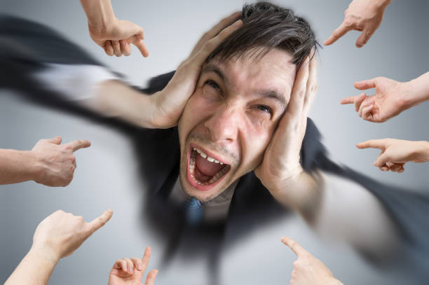 Middle-aged man scowls and shouts.
