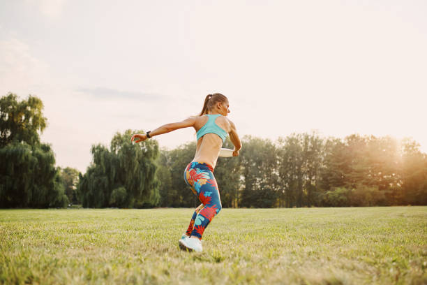 istock Young athletic girl playing with flying disc, ultimate 677501994