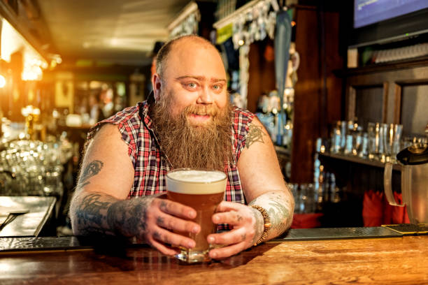 istock Happy fat man tasting alcohol beverage 677521124