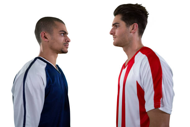 istock Two rival football player looking at each other 677522002