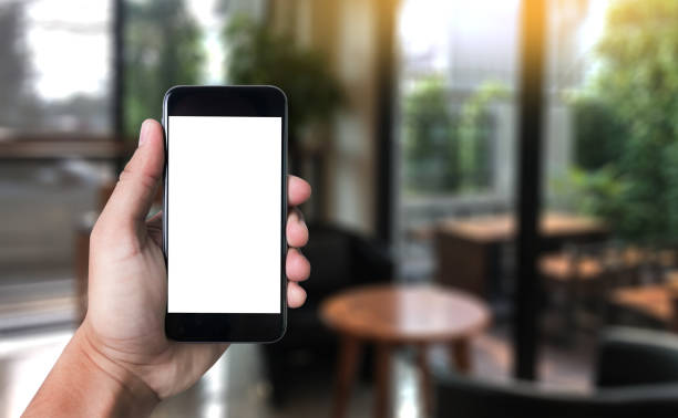 istock Mockup mobile  image of hand phone with blank white screen vintage tone. 677523338