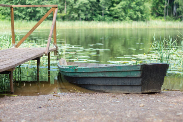 Wooden boat on the lake stock photo