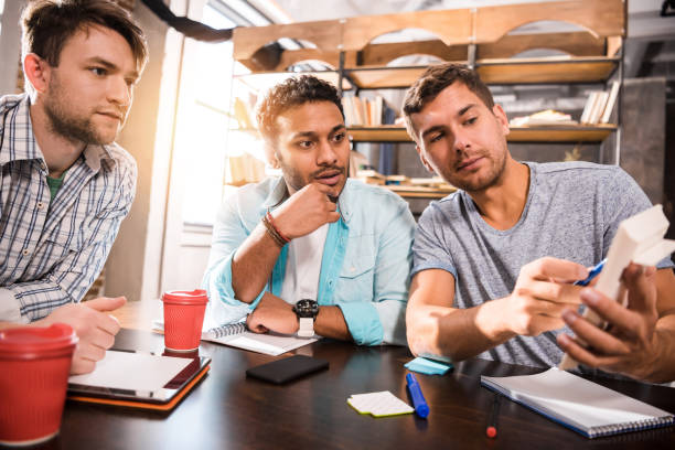 istock Young professional group working on new business project together 677534154