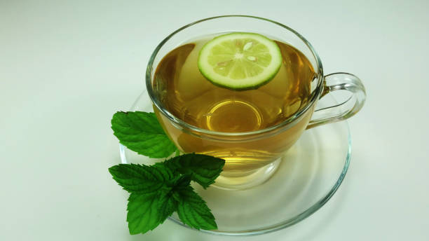 Hot herbal tea in glass cup stock photo