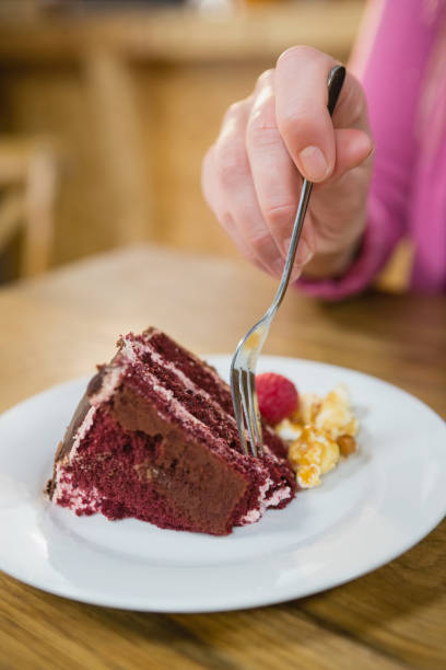 istock Close-up of woman having pastry 677570792