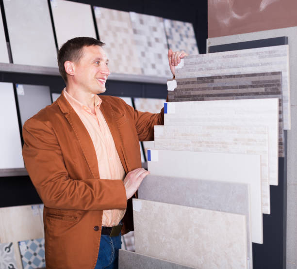 istock Buyer examines ceramic tiles 677581258