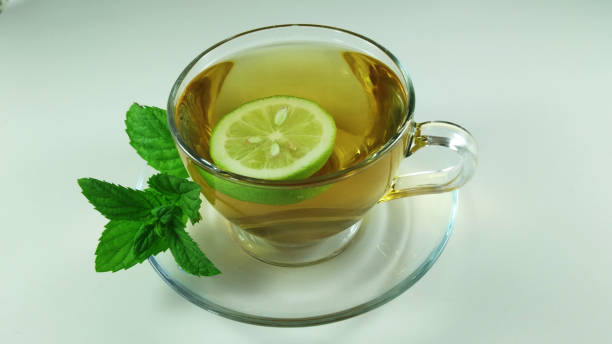 Hot herbal tea in glass cup stock photo