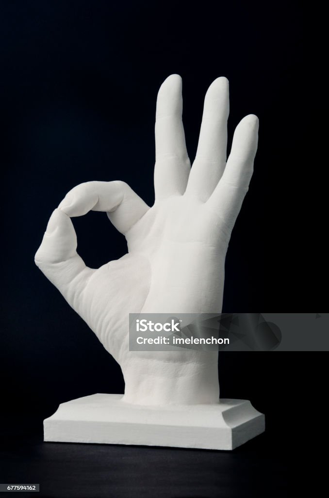 OK hand sign Statue of a man hand with OK gesture Hand Stock Photo