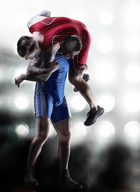 istock MMA fighters in lights background standing 677594370