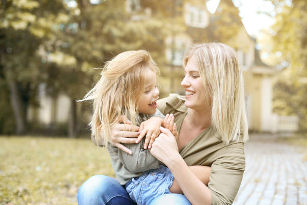 istock Mother and daughter playing outdoor. 677594924