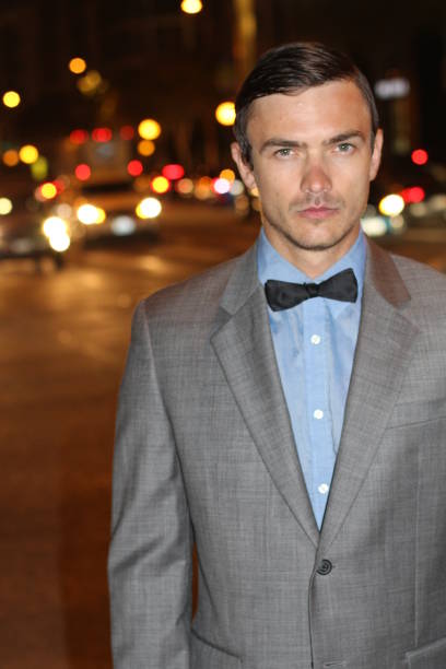 istock Attractive man at night with city lights 677624728
