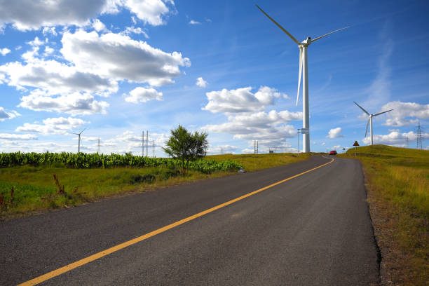 istock Empty road surface floor with Eco-environmentally friendly power generation of power turbines of green energy 677639750