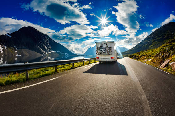 Caravan car travels on the highway. Caravan car travels on the highway. Tourism vacation and traveling. camper trailer photos stock pictures, royalty-free photos & images