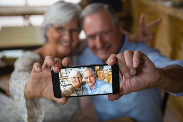 istock Happy senior couple taking selfie on mobile phone 677671954