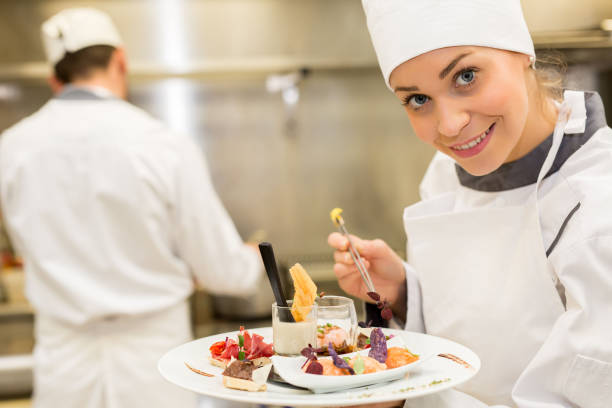 istock Young female chef cooking 677685660