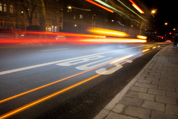 istock Bus lane and traffic at night 677695554