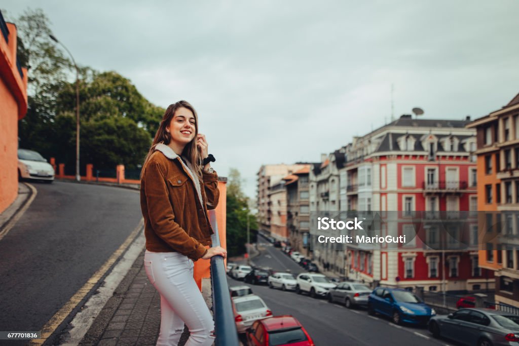 Young happy woman in urban environment A young happy woman in a urban environment 20-24 Years Stock Photo