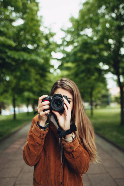 istock Young woman taking a picture 677701924