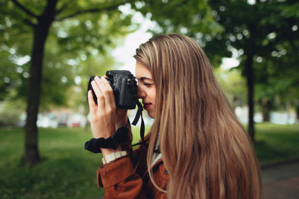 istock Young woman taking a picture 677701976