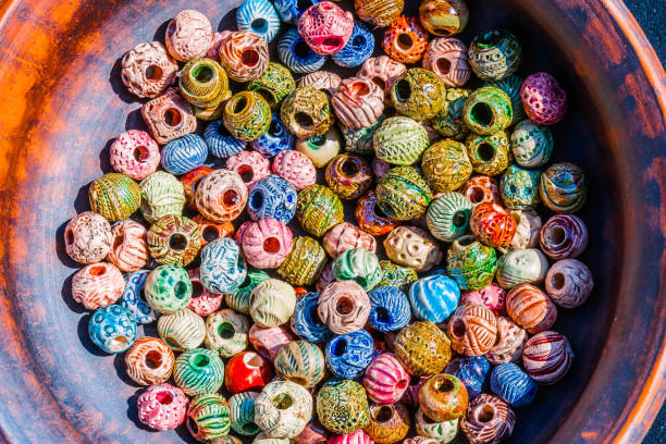 istock Colorful beads in a earthen dish 677704082