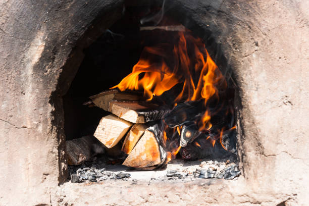istock Firewood burns in an ancient stove 677721050