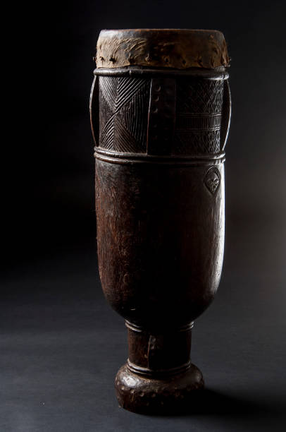 Handmade african instrument, wooden drum, isolated on black background Handmade african instrument, wooden drum, isolated on black background dybbuk stock pictures, royalty-free photos & images