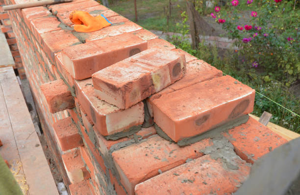 istock Bricklaying, Brickwork. Bricklaying Tips. How to build a brick wall. Bricklaying photo. 677739506