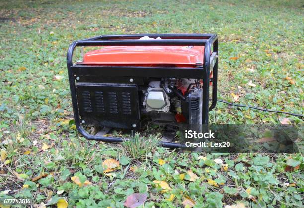 Gasoline Portable Generator Close Up On Mobile Backup Generator In The Garden Standby Generator Outdoor Power Equipment Stock Photo - Download Image Now