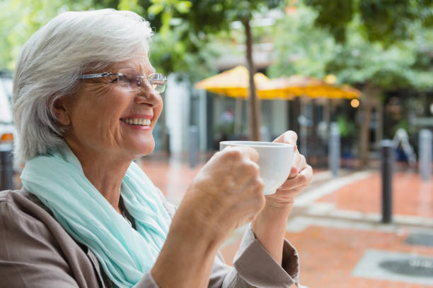 istock Senior woman holding a coffee cup 677753834