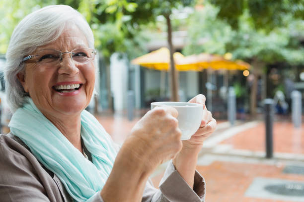 istock Senior woman holding a coffee cup 677753880
