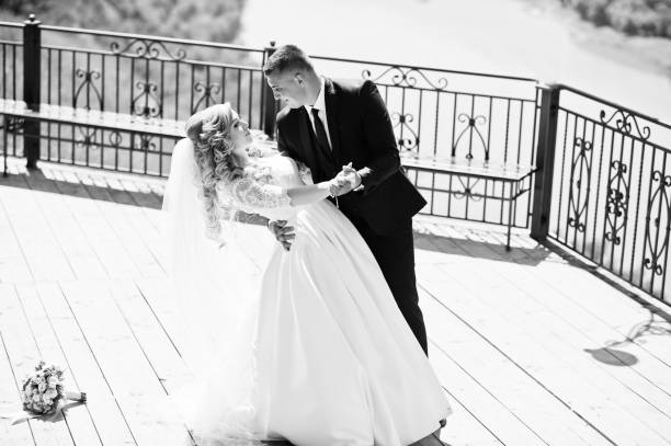 istock Happy wedding couple in love at observation deck on sunny day. 677762432