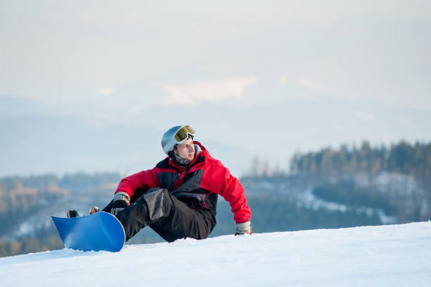 istock Male boarder on his snowboard at winer resort 677764572
