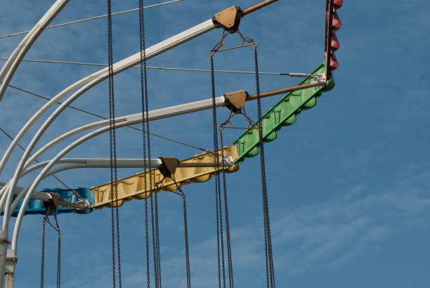 istock The old carousel on the background of blue sky, 677776792