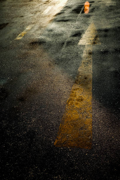 istock arrow sign on the road after raining 677789510