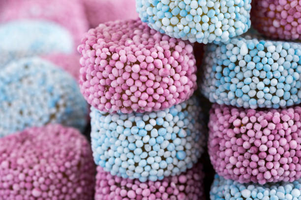 istock Gummy Candy Sprinkle Coated on Dark Stone Background 677804730
