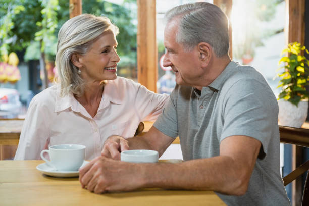 istock Senior couple sitting in cafe 677806994