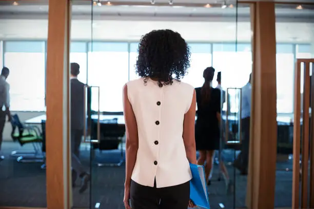 Photo of Rear View Of Businesswoman Entering Boardroom For Meeting