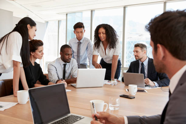 istock Group Of Businesspeople Meeting Around Table In Office 677810048