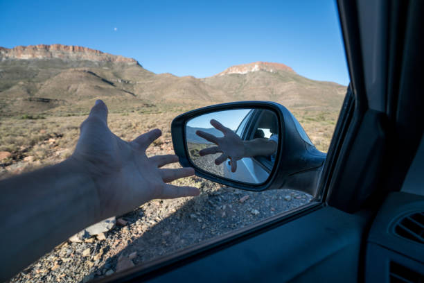 istock Man stretching out hand from window car 677812712