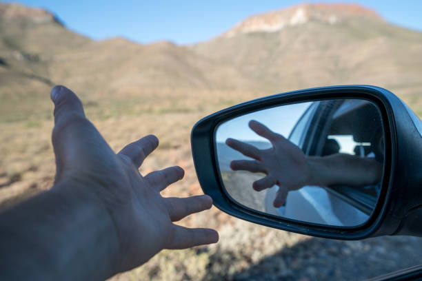 istock Man stretching out hand from window car 677813010