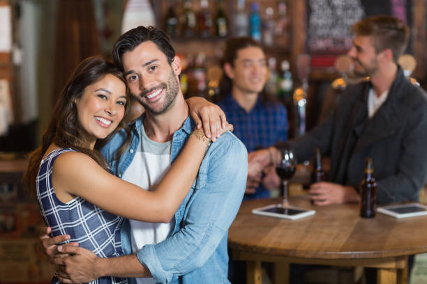 istock Smiling young couple embracing 677813960